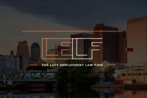 Logo of The Lacy Employment Law Firm superimposed on a cityscape at dusk with buildings and a bridge in the background.